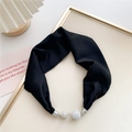 Close-up of a black silk scarf necktie featuring a sparkling rhinestone magnetic buckle - Black