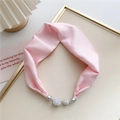 Pink satin neck scarf detail showing shiny magnetic rhinestone buckle and soft fabric texture - Light Pink