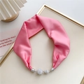Close-up of pink satin neck scarf with a silver magnetic clasp adorned with rhinestones - Magenta
