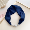 Close-up of navy silk scarf featuring silver rhinestone magnetic buckle ornaments - Navy Blue
