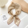 Beige lightweight silk scarf with pink hem detail tied in a stylish knot - Khaki