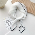 Elegant white square silk scarf with minimalist black trim edge in a stylish knot - White