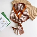 Brown and cream striped skinny silk scarf tied on a wavy wooden tray prop - Dusty Pink Stripes