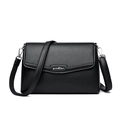 Minimalist black pebble leather shoulder bag with silver hardware and adjustable strap - Black