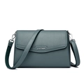 Minimalist dark green cross-body bag with lychee texture and silver logo detail - Green