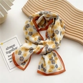 Floral print narrow silk scarf in orange and yellow with elegant knotted styling - 19 Chiffon Two-Tone Flower Orange Border