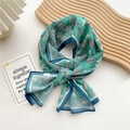 Mint green silk scarf with leaf patterns and navy blue borders on a wooden tray - 21 Chiffon Leaf Blue Border
