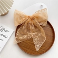 Elegant apricot lace bow hair clip with floral embroidery and long ribbons on wooden tray - 14*130cm / Orange