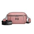 Pink pebbled leather crossbody bag with wide woven strap and silver zipper detail - Pink