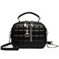 Black quilted crossbody bag with silver bear pendant and chain strap on white background - Black