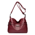 Deep red leather crossbody bag with lychee texture and silver kangaroo logo - Burgundy