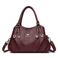 Burgundy faux leather handbag with lychee texture and kangaroo logo on white background - Burgundy