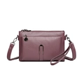 Chic mauve crossbody bag with multi-layer zippers and metal buckle in textured faux leather - Purple
