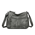 Retro grey multi-pocket crossbody bag with long tassels and rivet details on white background - Gray