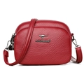 Red textured faux leather crossbody bag with triple zipper pockets and adjustable strap - Red