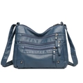 Bolso bandolera azul oscuro con múltiples bolsillos en piel suave y cremalleras - Azul