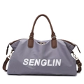 Large gray-purple travel bag with brown leather handles and adjustable shoulder strap - Gray