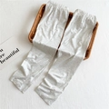 Detail of high-elastic waist on grey cotton knit leggings for kids on woven background - One Size / Light Gray