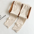 Detailed view of elastic waist and smooth satin fabric on off-white cooling arm sleeves - One Size / Apricot