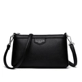 Sac enveloppe noir chic en cuir grainé avec finitions argentées et bandoulière amovible - Noir