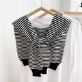 Detail of a black and white striped knitted shawl with front tie on a white shirt - Striped Black / 40x95cm