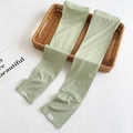 Close-up of light green ice silk sun protection sleeves on a woven decorative tray - Green (BX0050)