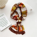 Slim silk-feel scarf with vintage geometric patterns in brown, orange, and mustard yellow - Design Pattern Brown Edge