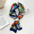 Narrow silk scarf with geometric color-block patterns in orange and green tones - Design Pattern Blue Edge