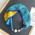 Detail of silk scarf necklace with floral patterns and sparkling magnetic rhinestone clasps - Lake Blue with Yellow Little Fish (11M Outlined Fish)