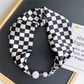 Detail of checkered silk scarf featuring sparkling rhinestone magnetic ball clasps - Black and White Checkerboard (16M)