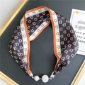 Close-up of silk scarf necklace with monogram print and magnetic rhinestone balls - Black with D-Letter Frame