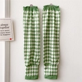 Close-up of green diamond checkered sun protection arm sleeves with elastic cuffs - Diamond Lattice Green and White Print
