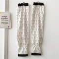 Close-up of cream ice silk sun sleeves with black bear pattern and elastic cuffs - Outlined Bear Black and White Print