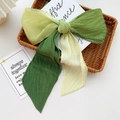 Pleated oversized bow hair clip in forest green and pale yellow colorblock design - Gradient Light Green