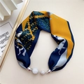 Detail of silk scarf with horse print and rhinestone encrusted magnetic ball charms - Yellow Blue Equestrian Horse