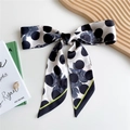 Polka dot silk scarf with blue rose pattern and lime green edge displayed on a tray - 125cmx7cm / Polka Dot Rose