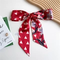 Red long silk ribbon scarf with white triangles and floral lily print on a wooden tray - 125cmx7cm / Triangle Magnolia Red