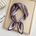 Elegant purple houndstooth pleated square scarf in a delicate bow on a gold tray - Purple Houndstooth Stripe
