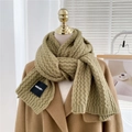 Detail of chunky knit olive green winter scarf with stylish woven texture and brand label - Green
