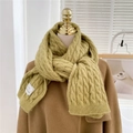 Detail of thick mustard green cable knit scarf texture and minimalist label design - Light Green