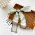 Sage green silk ribbon with bow design and white border for hair or bag styling - Light Green Patchwork
