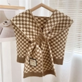 Detailed knit texture of checkerboard shawl with ribbed edges and smiley patch - Khaki Checkerboard