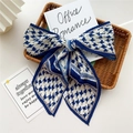 Blue and white houndstooth pleated silk scarf folded elegantly on a woven tray - Pleated Navy Houndstooth