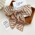 Pleated long silk scarf with brown houndstooth pattern styled as a large bow knot - Pleated Khaki Houndstooth