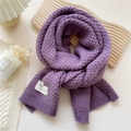 Purple chunky knit scarf with handmade label on a warm wooden aesthetic background - 32x175cm / Purple