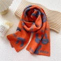 Bright orange knitted scarf with blue bunny jacquard pattern and soft winter wool texture - Orange
