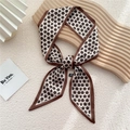 Elegant beige and brown floral silk twilly scarf tied in a bow on a wooden display - Beige Small Floral (1F)