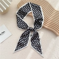 Elegant black and white floral twilly scarf tied in a bow with sleek white edges - Black Small Floral (2F)