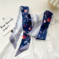 Blue silk skinny scarf with red tulip floral pattern displayed on a white shirt - Tulip Navy Base (10DRY)