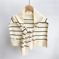 Detail of knit shawl wash label showing material mix of polyester, nylon and acrylic - Creamy White Stripes
